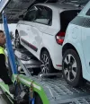 Renault Trucks driver attaching cars to be transported on a trailer