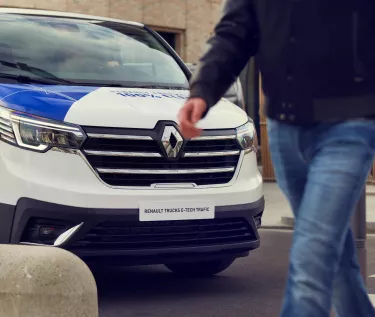 Trafic e-tech park in the street and someone is walking on a crosswalk
